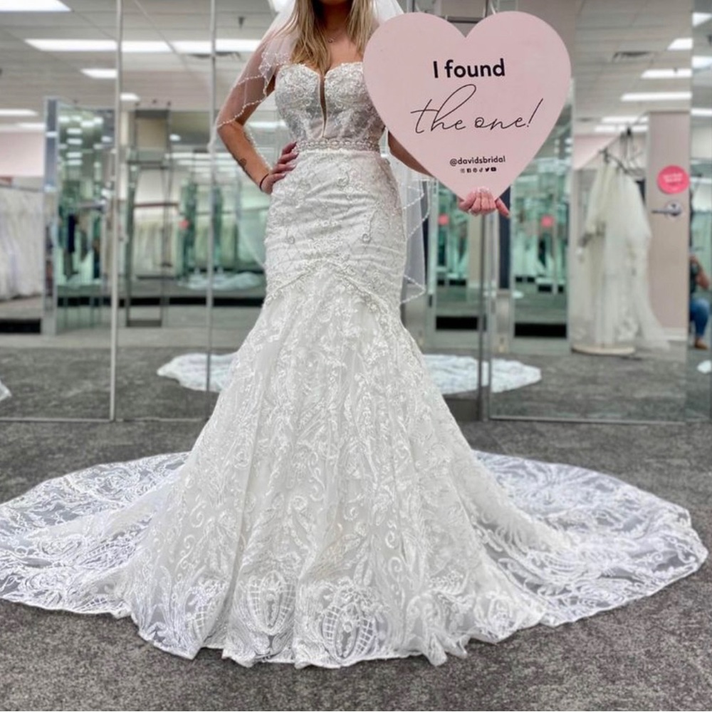 Brand new with tags wedding dress with petty coat size 2